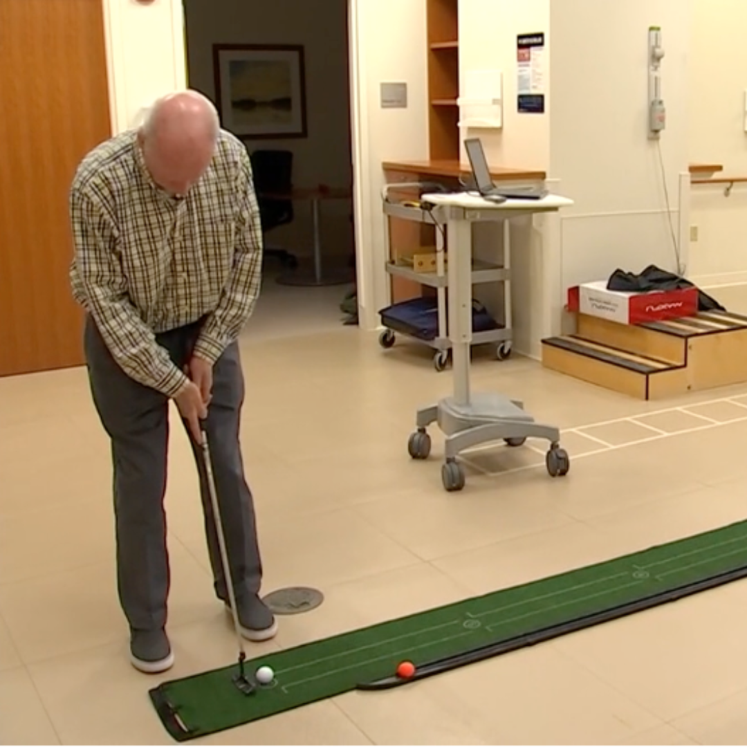 stroke survivor playing mini golf after vivistim therapy